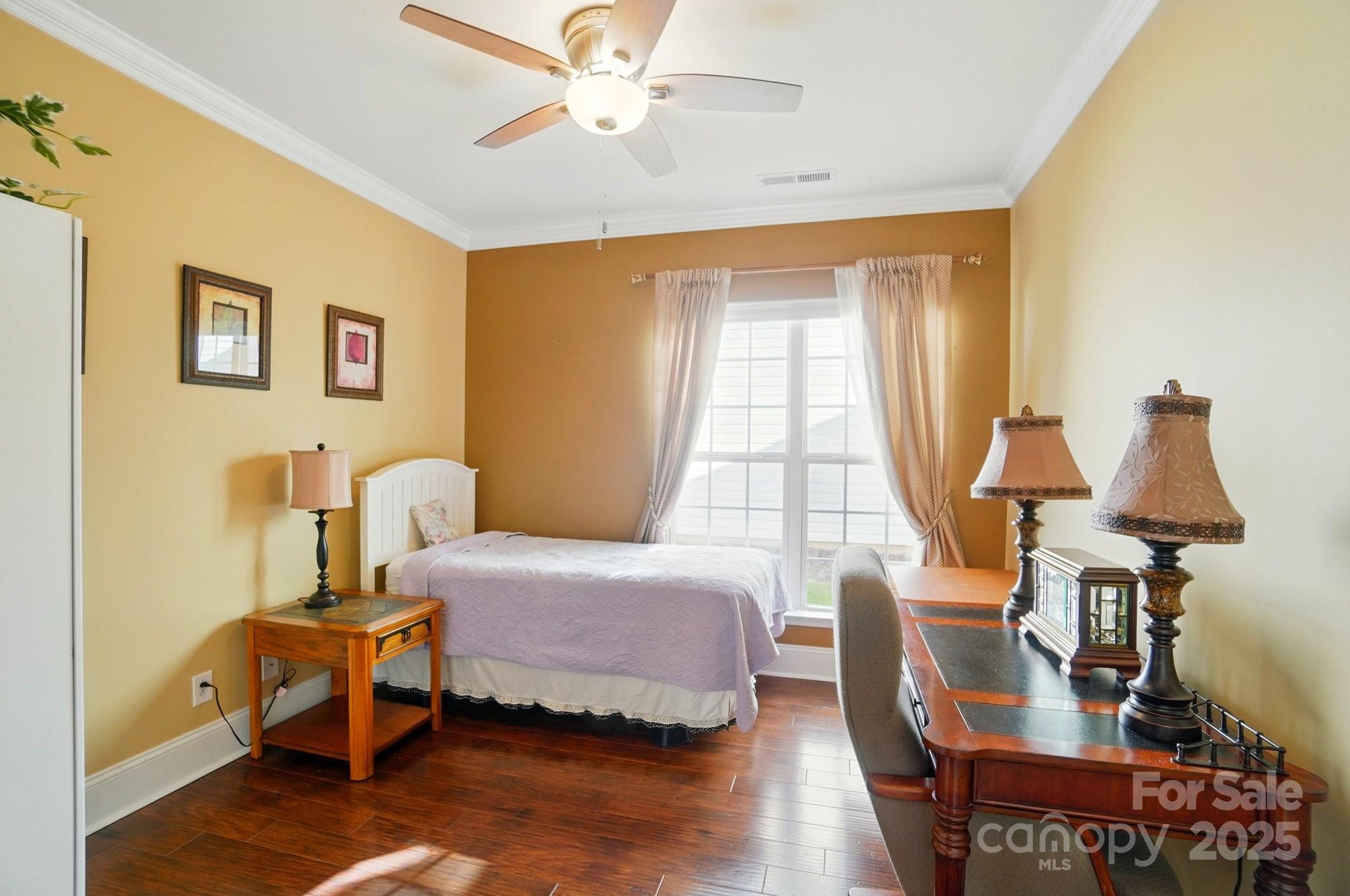 1974 Links View Drive Fort Mill, SC 29707 - Photo 20 of 30 a bedroom with a bed and wooden floor