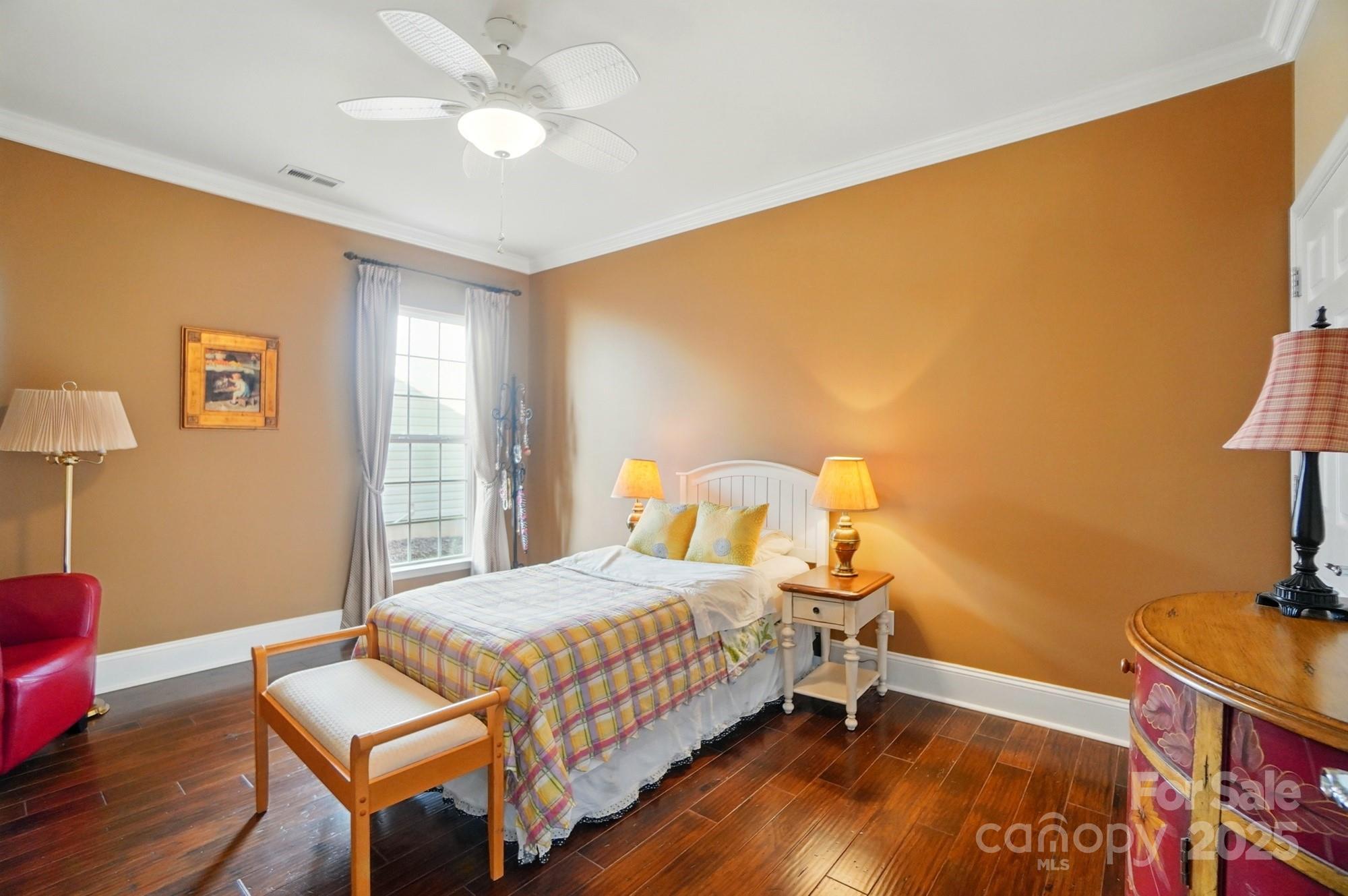 1974 Links View Drive Fort Mill, SC 29707 - Photo 23 of 30 a bedroom with a bed and wooden floor