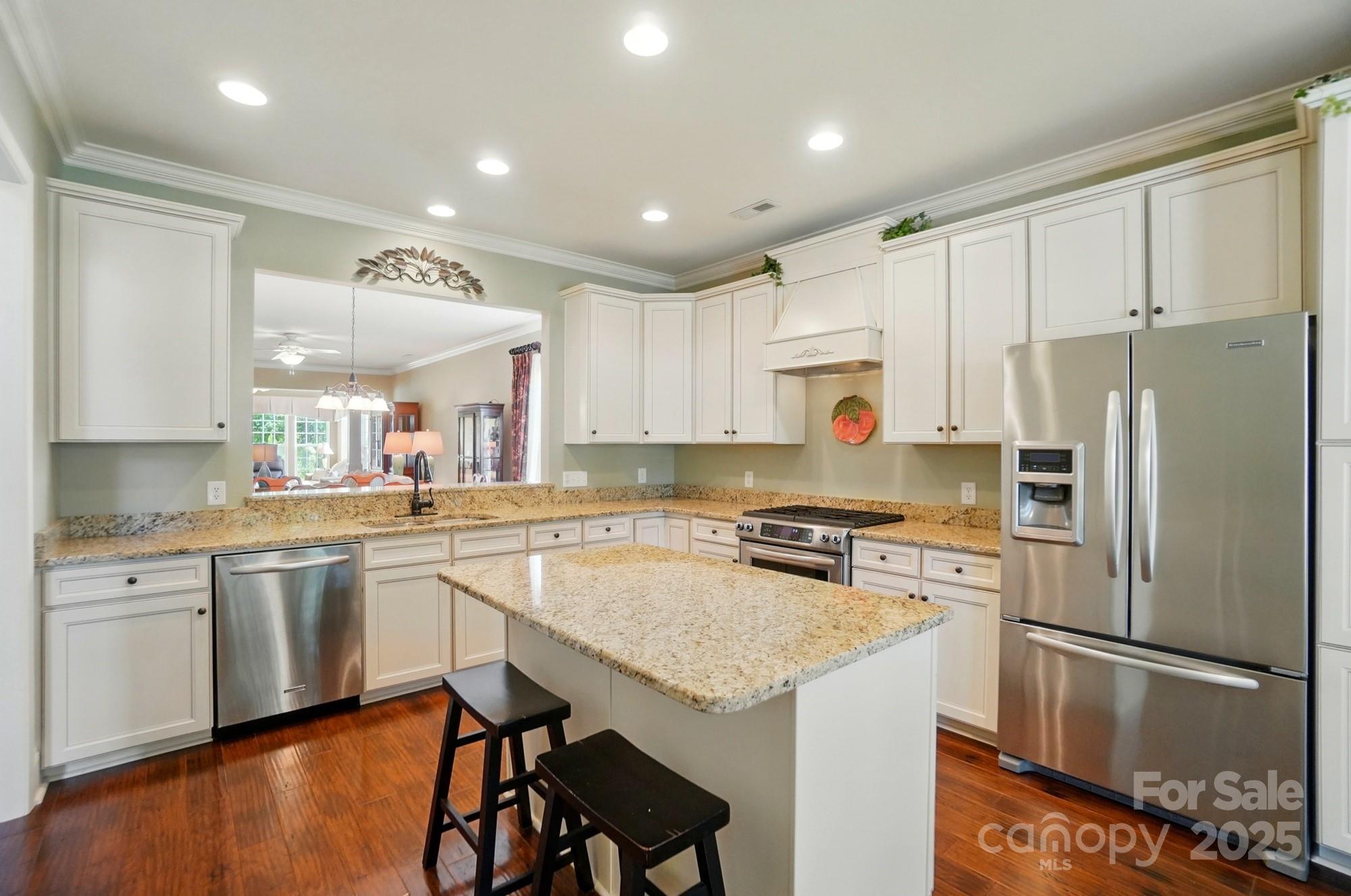 1974 Links View Drive Fort Mill, SC 29707 - Photo 5 of 30 a kitchen with a refrigerator a sink and white cabinets