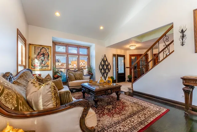 a living room with furniture and a rug