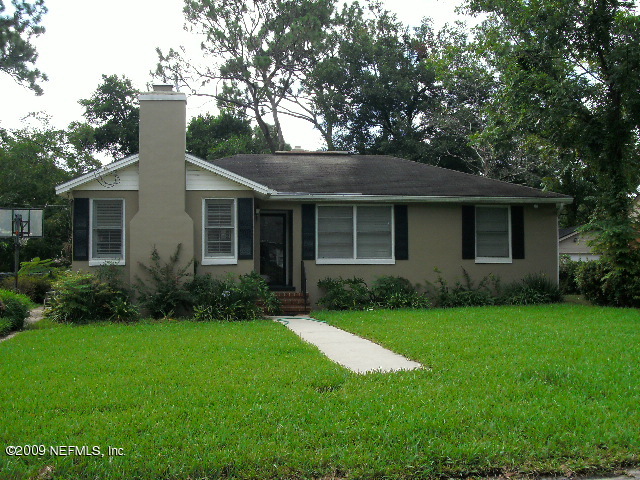 4135 Dover Road Jacksonville, FL 32207 - Photo 1 of 5 a front view of a house with a garden and yard