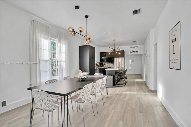a living room with furniture fireplace and window