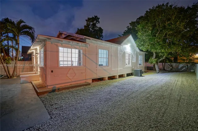 a view of backyard with wooden floor and a potted plant
