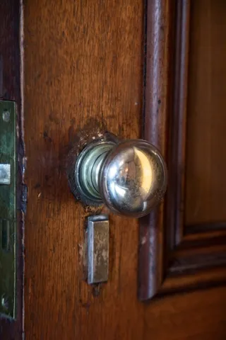 a picture of a glass door with a potted plant on it