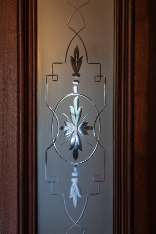 56 Rutland Square Boston, MA 02118 - Photo 26 of 29 a picture of a glass door with a potted plant on it