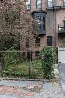 a front view of a house with lots of green space