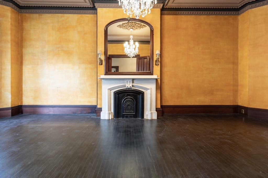 56 Rutland Square Boston, MA 02118 - Photo 4 of 29 a view of empty room with wooden floor and fan