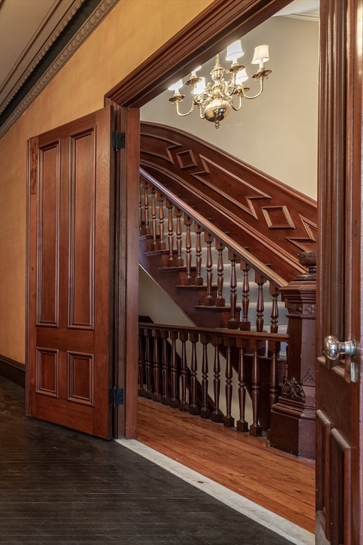 56 Rutland Square Boston, MA 02118 - Photo 6 of 29 a view of staircase with wooden floor and fan