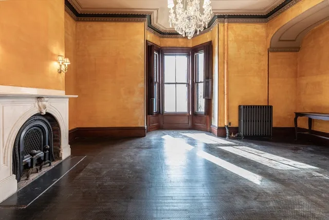 a view of a livingroom with furniture and chandelier