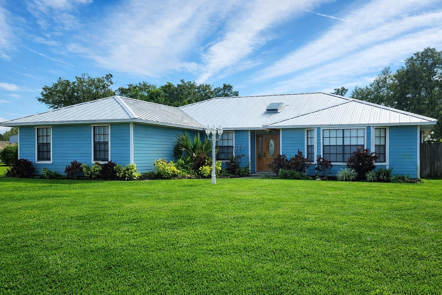 728 North Fischer Circle Sebastian, FL 32958 - Photo 1 of 23 a front view of a house with a garden