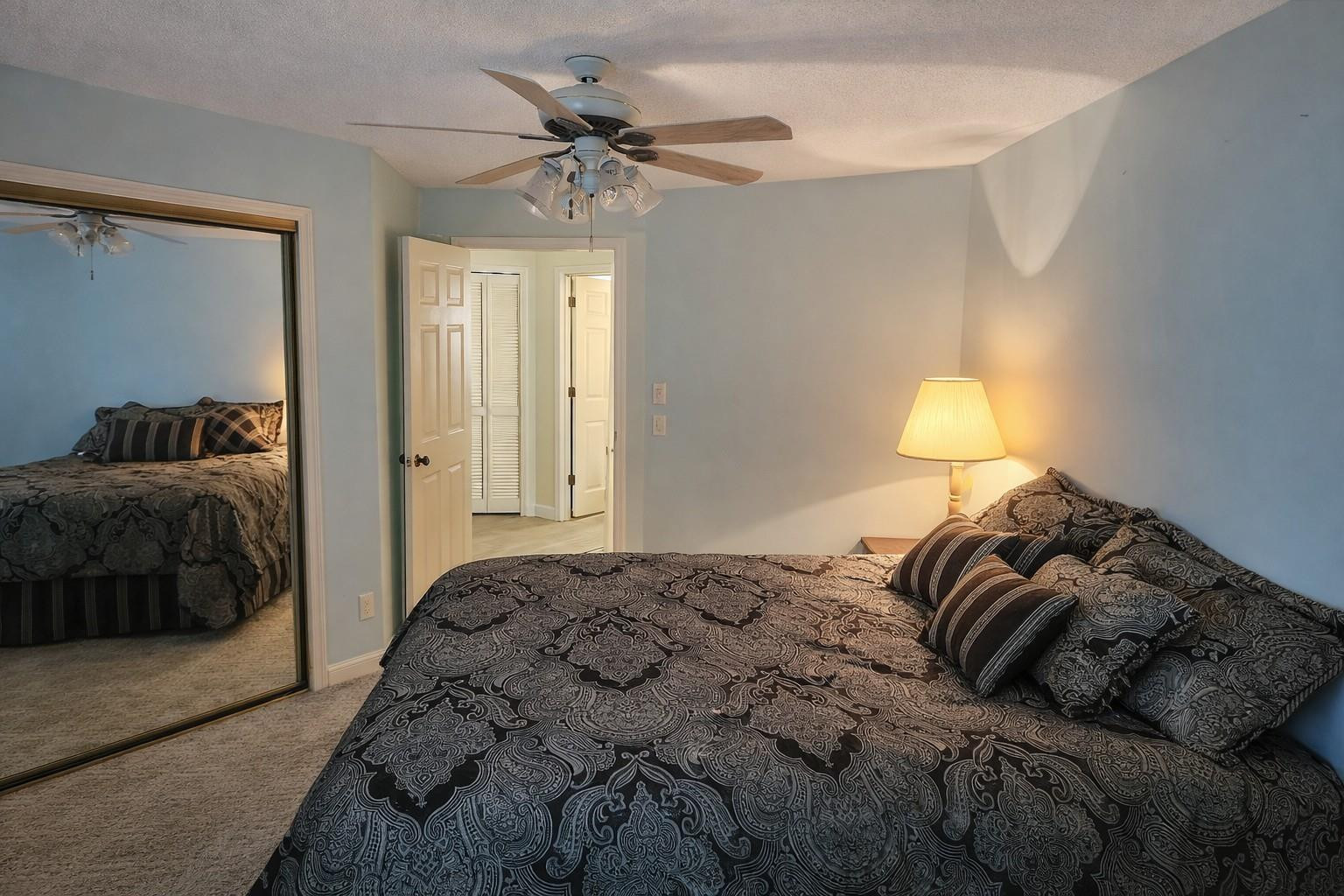 728 North Fischer Circle Sebastian, FL 32958 - Photo 12 of 23 a bedroom with a bed and a lamp