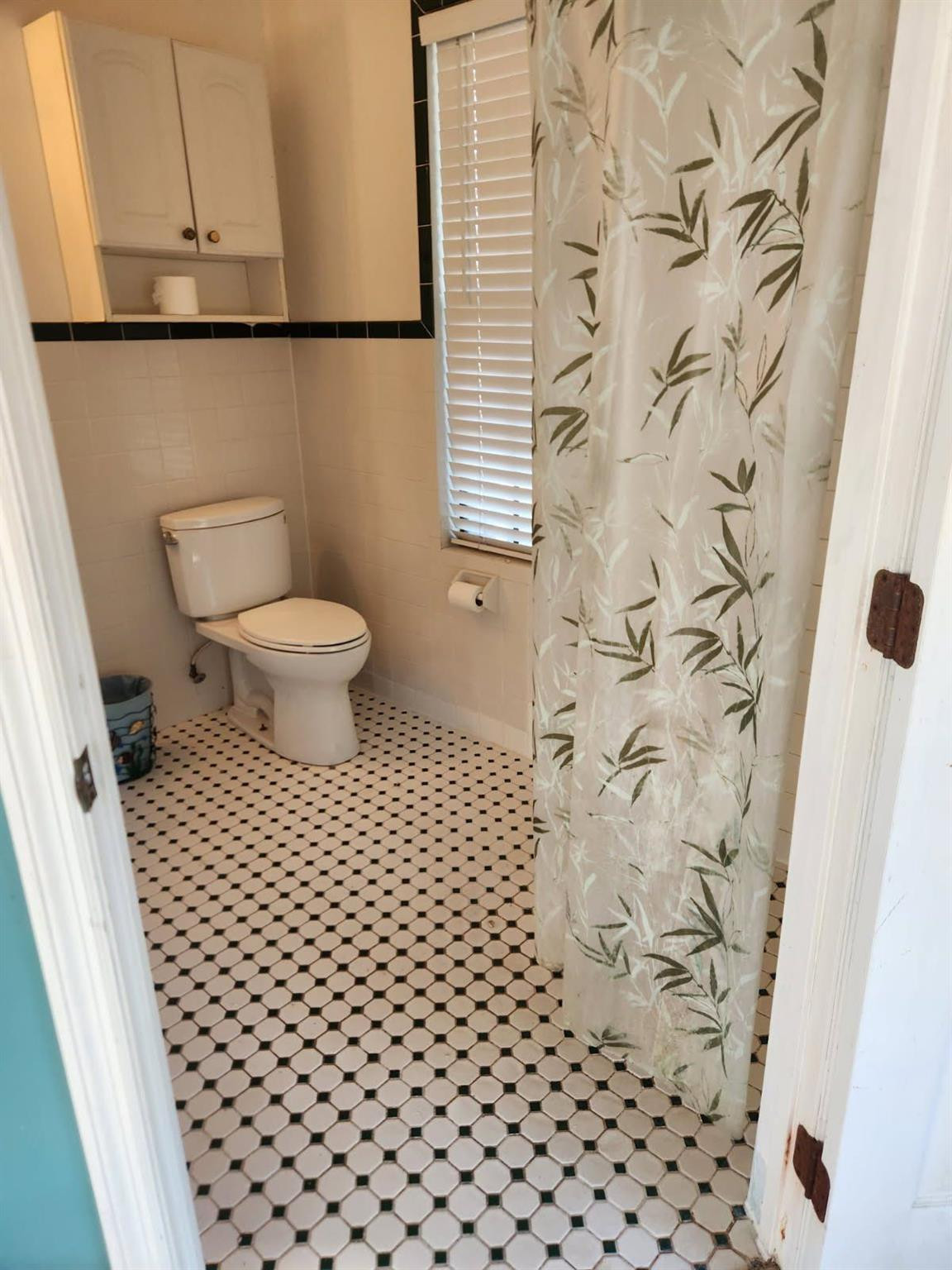 728 North Fischer Circle Sebastian, FL 32958 - Photo 16 of 23 a bathroom with a toilet and a shower curtain