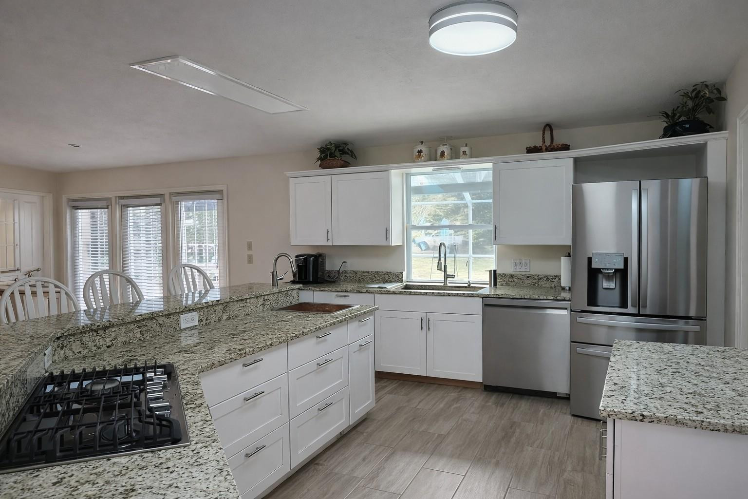 728 North Fischer Circle Sebastian, FL 32958 - Photo 2 of 23 a kitchen with stainless steel appliances granite countertop a sink stove and refrigerator