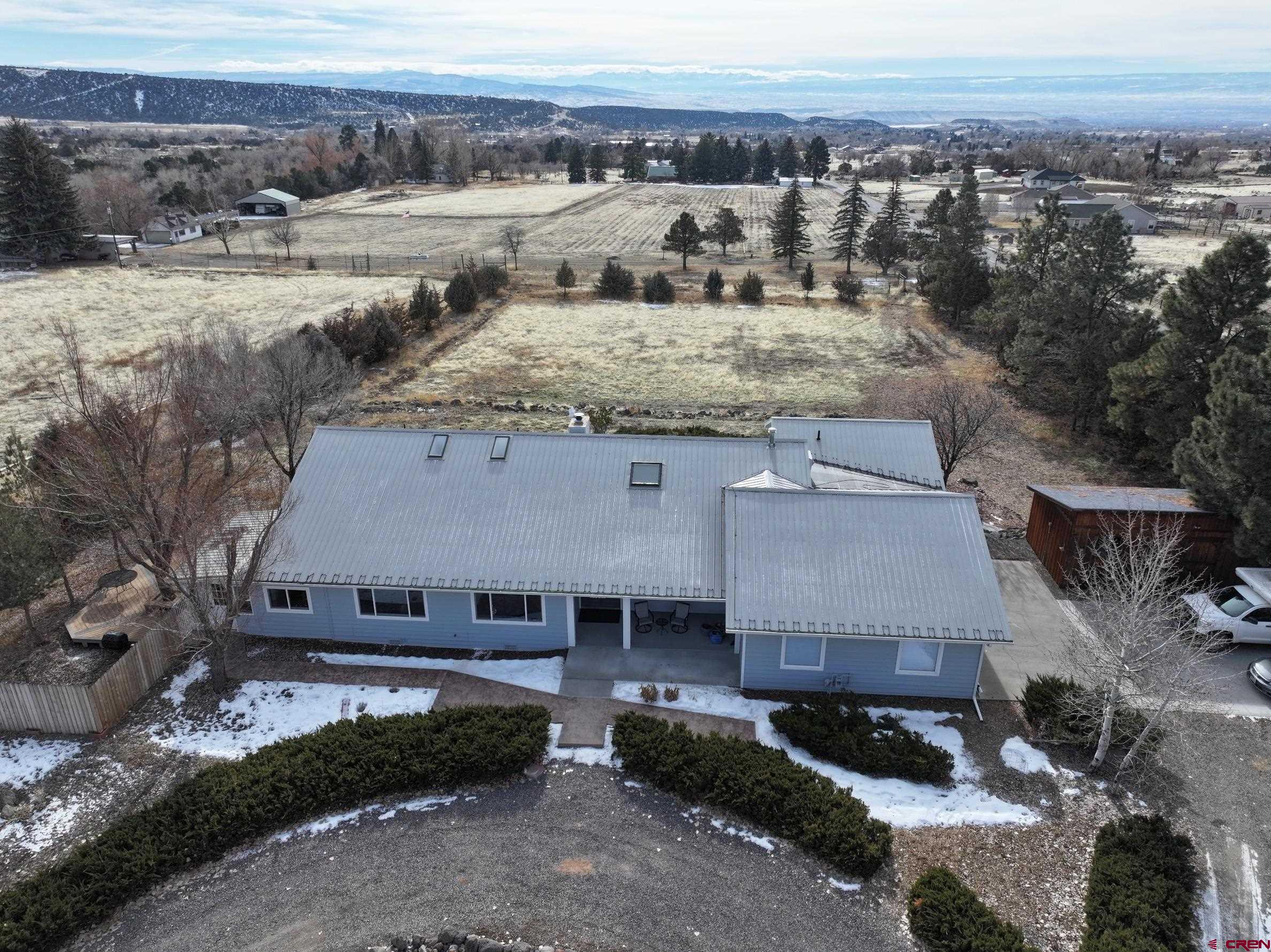 23766 Snowflake Road Cedaredge, CO 81413 - Photo 1 of 1 an aerial view of a house with a yard