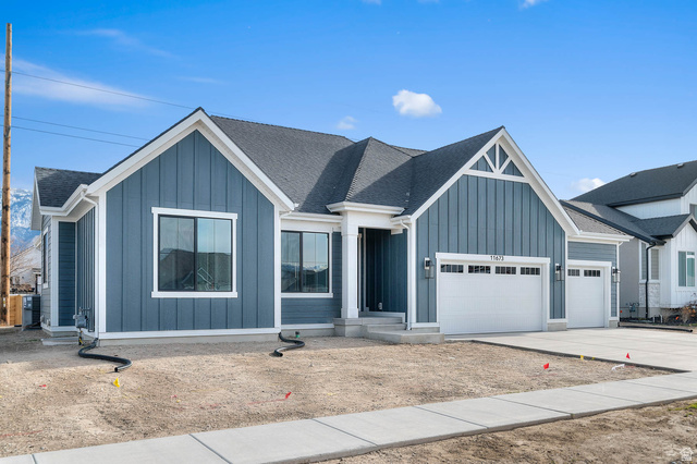 11673 South Halls Crk Road Draper, UT 84020 - Photo 3 of 22 Modern farmhouse exterior featuring blue vertical siding and white trim