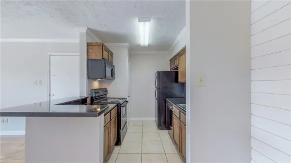 a kitchen with a refrigerator and a sink