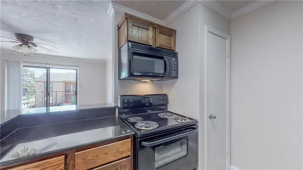 a kitchen with a stove and a microwave