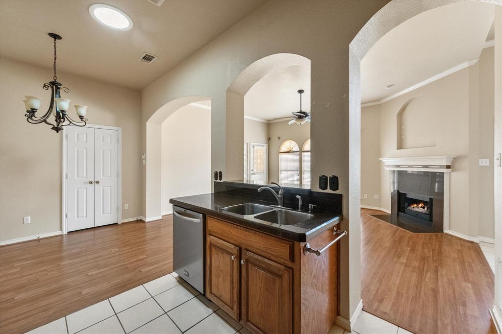 2327 Ragland Road Mansfield, TX 76063 - Photo 13 of 31 a kitchen with granite countertop a sink and a stove