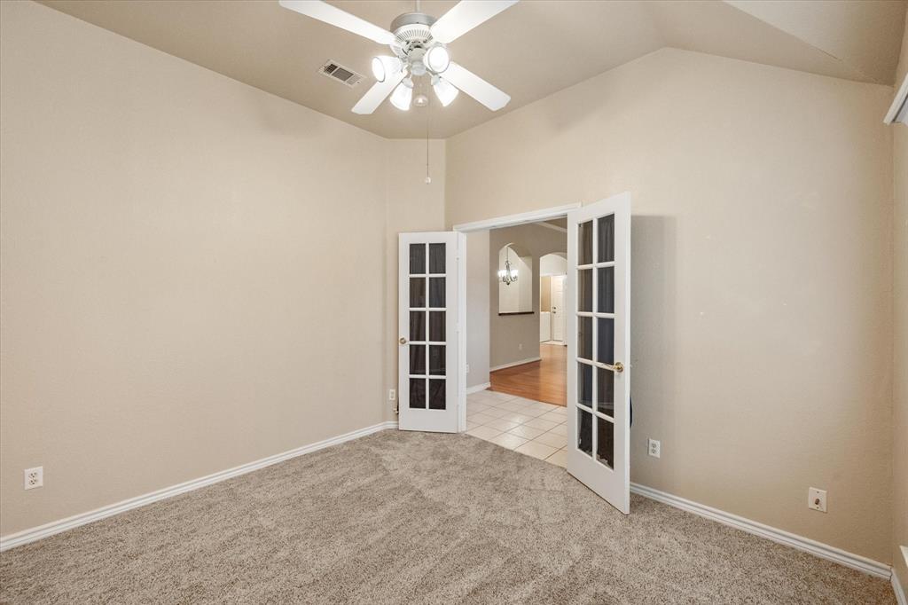 2327 Ragland Road Mansfield, TX 76063 - Photo 4 of 31 an empty room with windows and ceiling fan