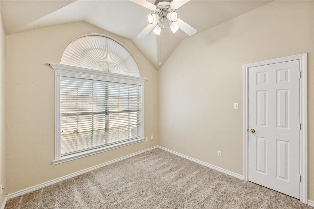 2327 Ragland Road Mansfield, TX 76063 - Photo 5 of 31 an empty room with chandelier fan and windows