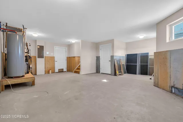 a view of a livingroom with furniture and refrigerator