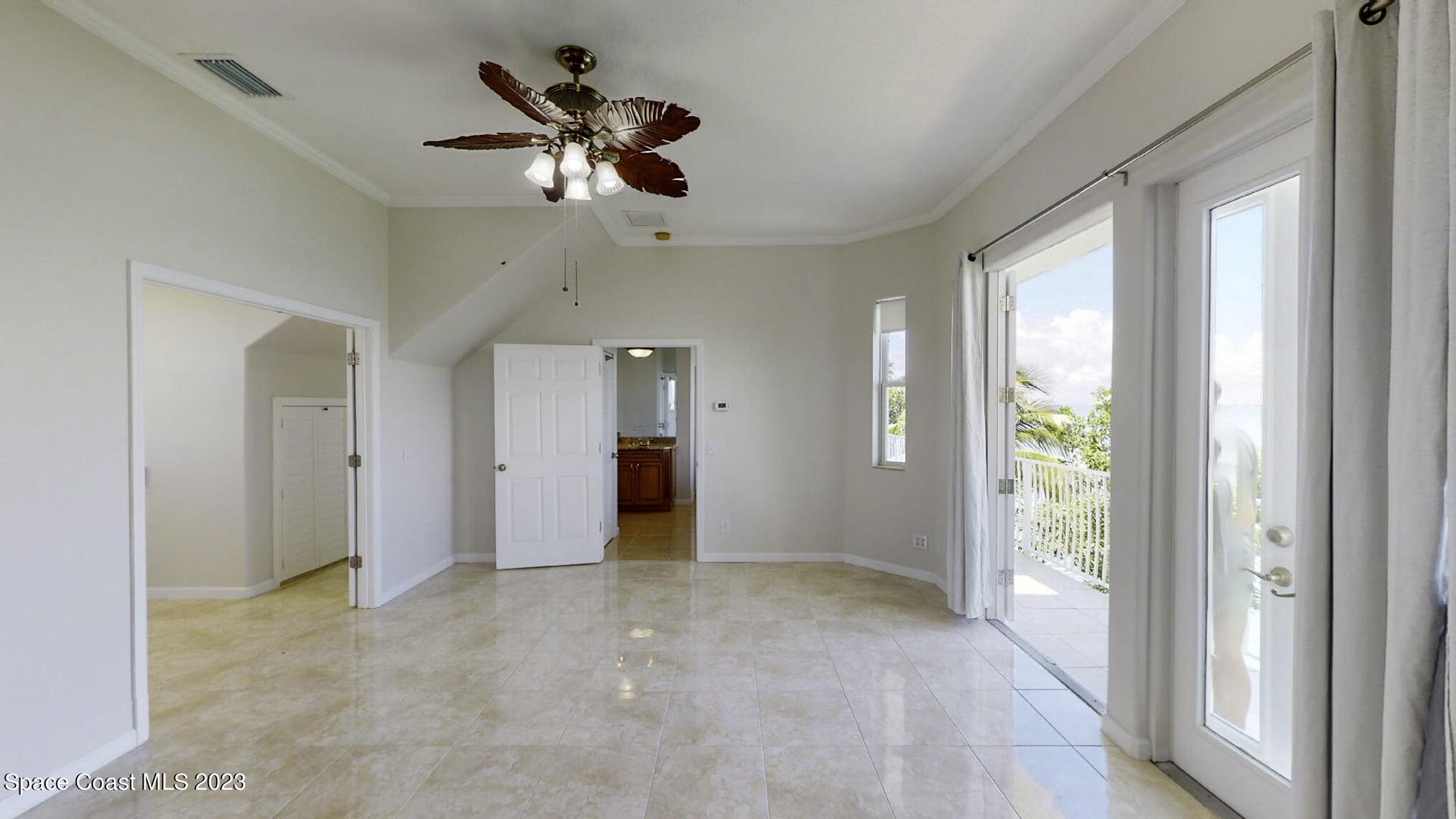 21 West Point Drive, Unit 101 Cocoa Beach, FL 32931 - Photo 32 of 59 a view of an empty room with a window