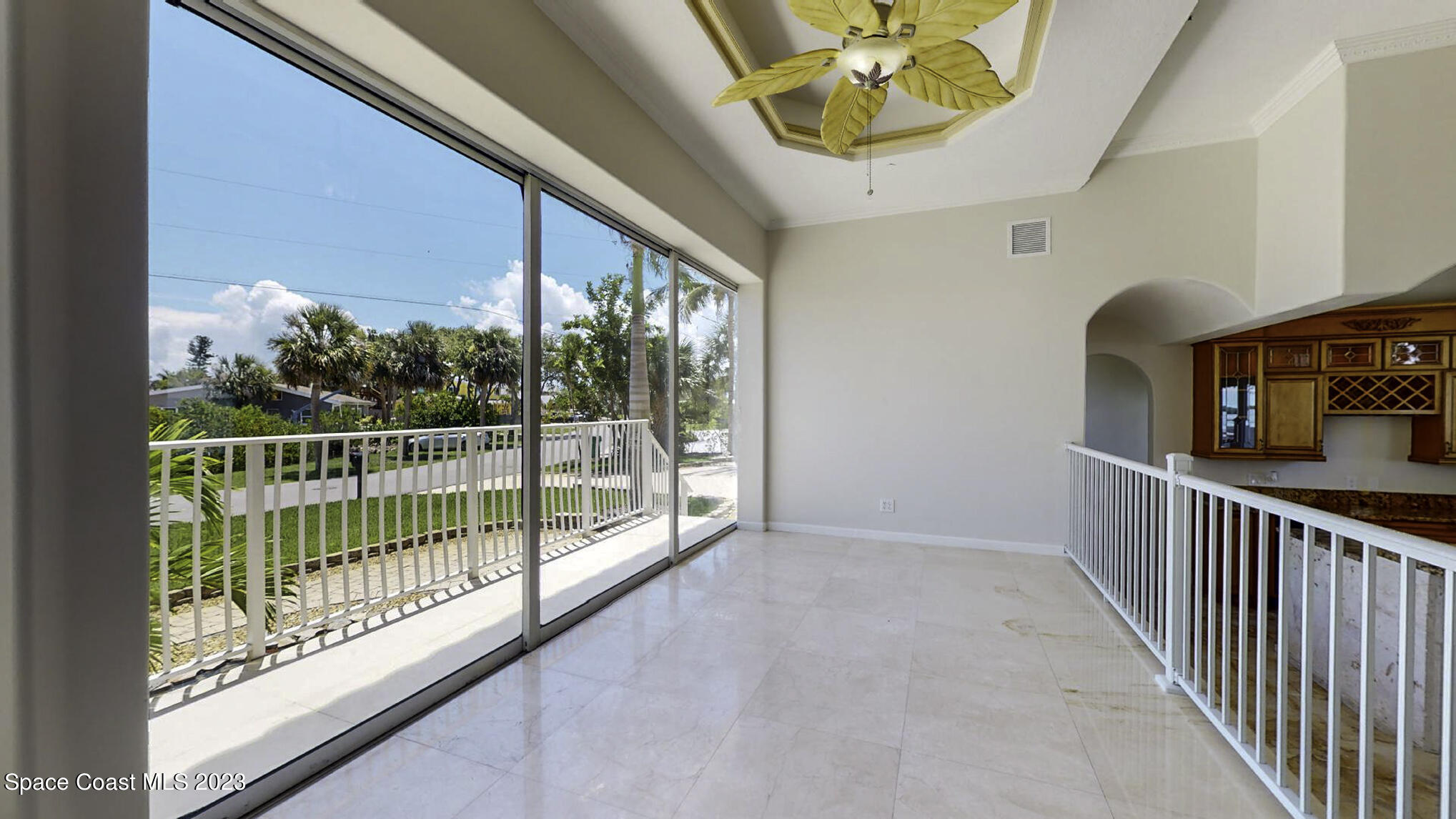 21 West Point Drive, Unit 101 Cocoa Beach, FL 32931 - Photo 36 of 59 a view of a porch with wooden floor