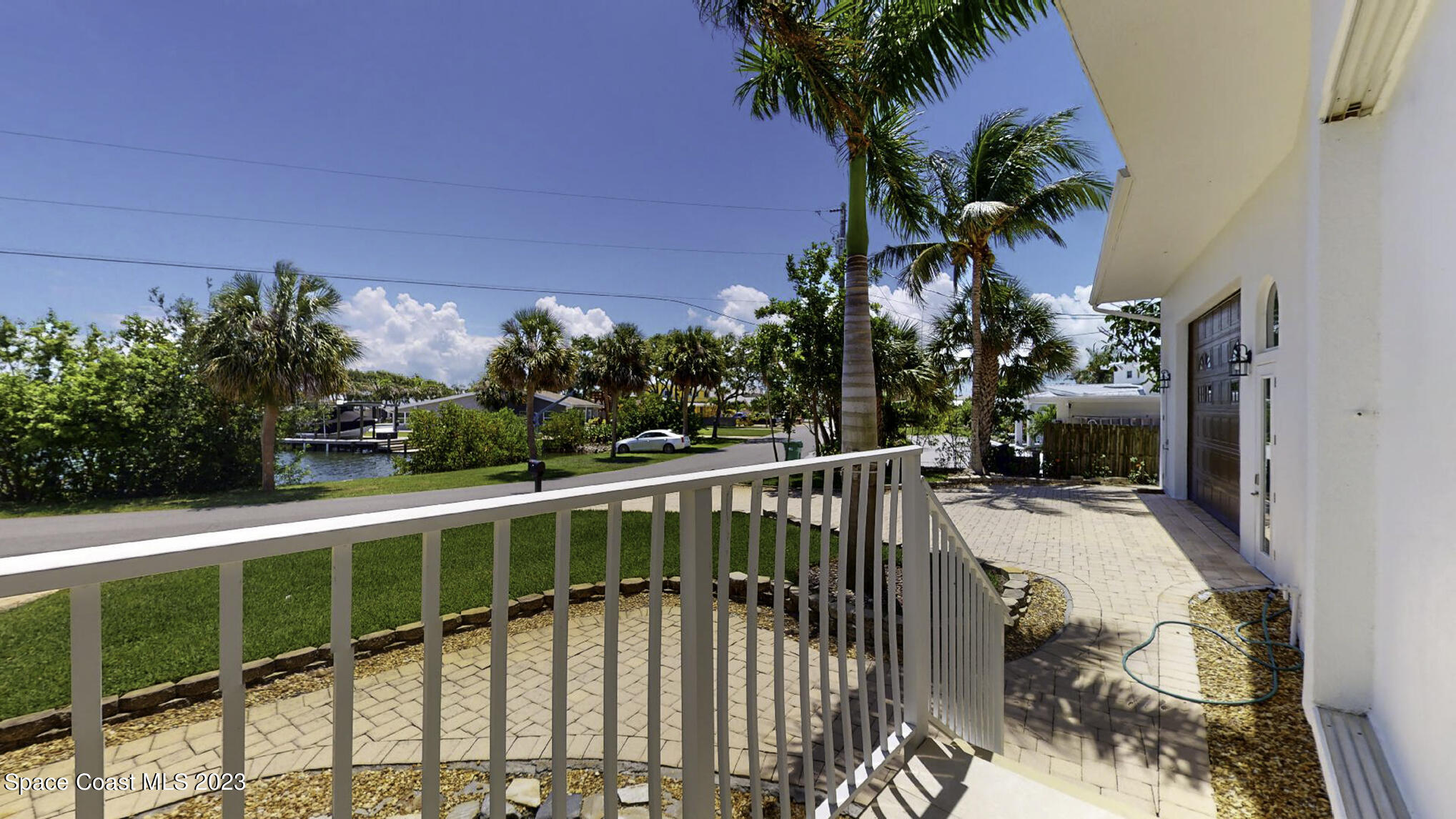 21 West Point Drive, Unit 101 Cocoa Beach, FL 32931 - Photo 57 of 59 a view of a balcony with plants