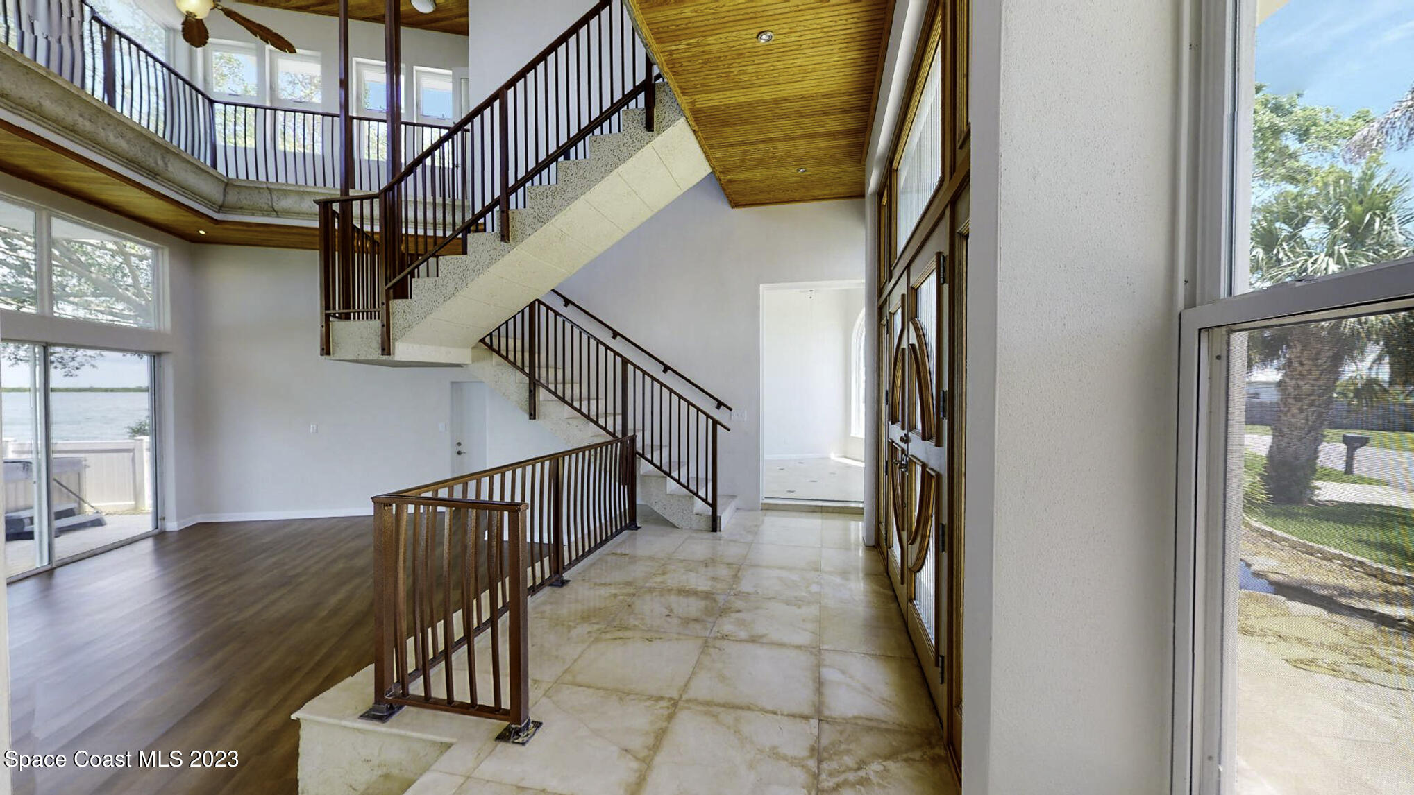 21 West Point Drive, Unit 101 Cocoa Beach, FL 32931 - Photo 6 of 59 a view of entryway and hall with wooden floor