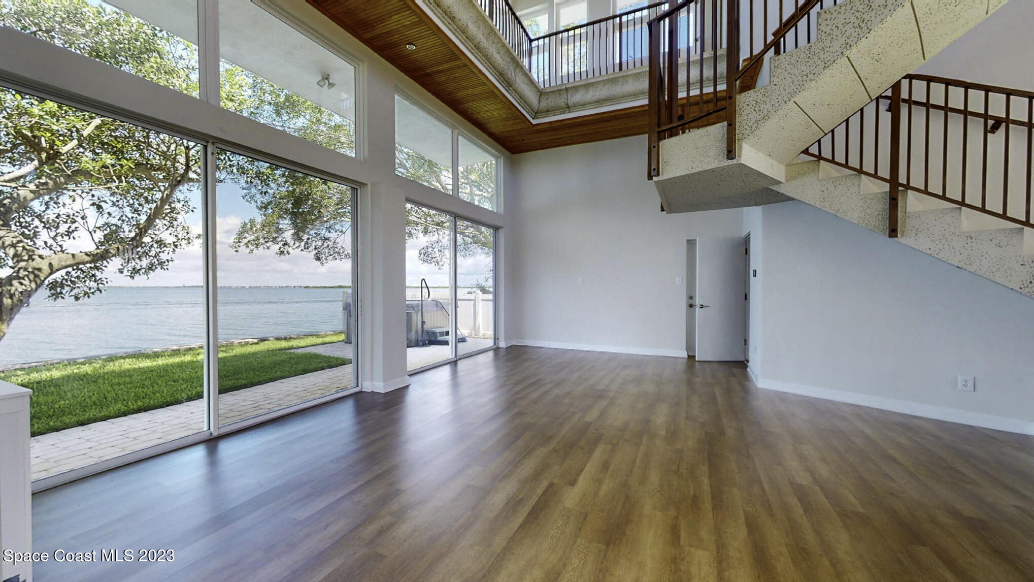 21 West Point Drive, Unit 101 Cocoa Beach, FL 32931 - Photo 7 of 59 a view of an entryway with wooden floor