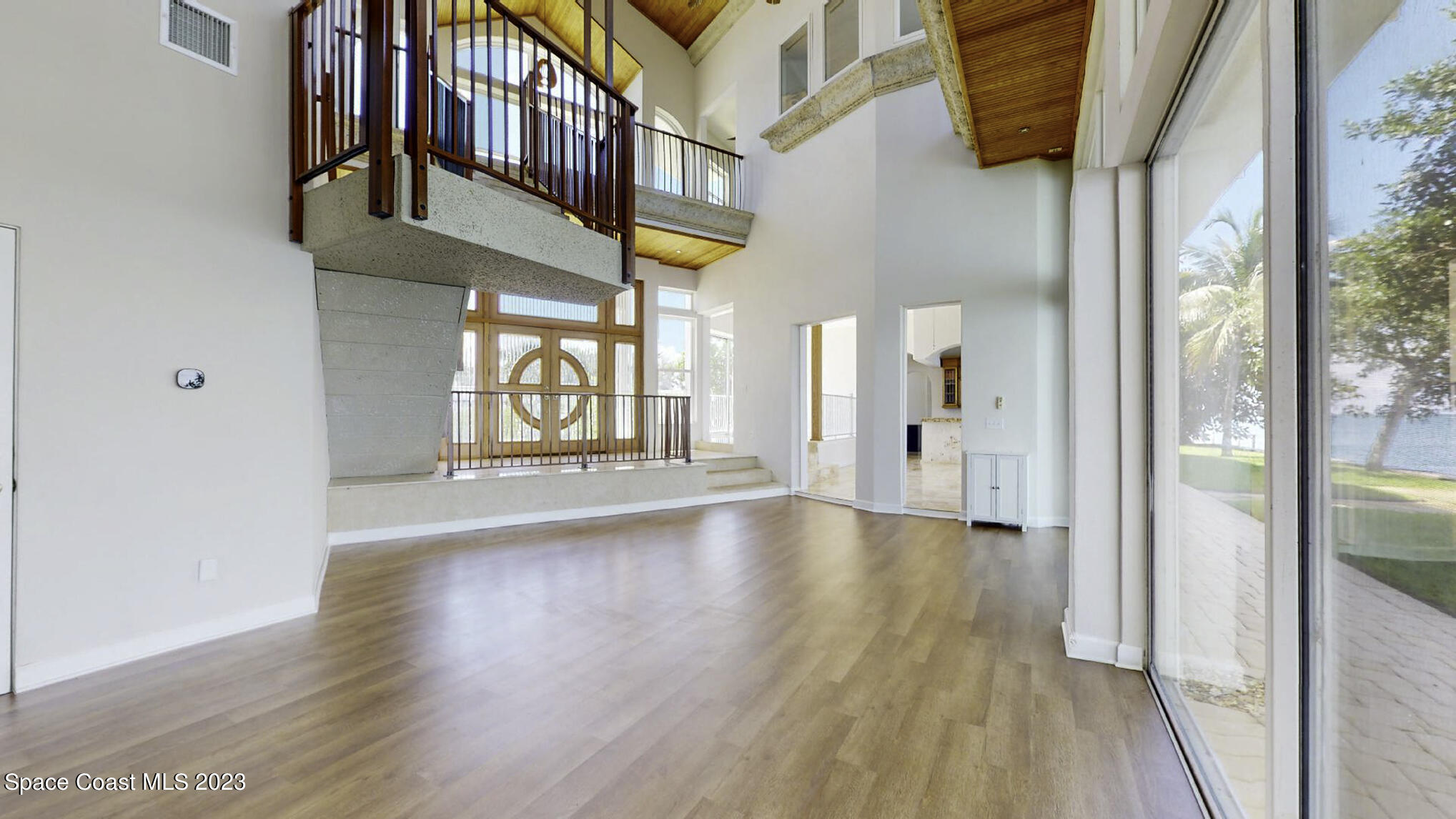 21 West Point Drive, Unit 101 Cocoa Beach, FL 32931 - Photo 10 of 59 a view of an entryway with wooden floor