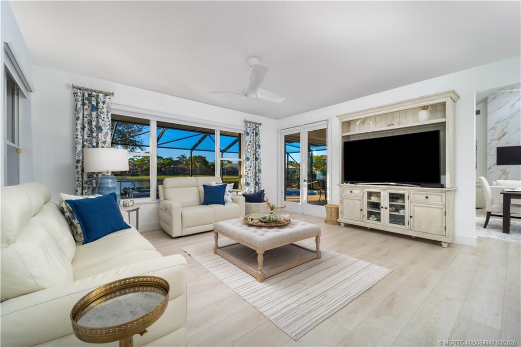 1257 Southeast Brewster Place Stuart, FL 34997 - Photo 19 of 35 a living room with furniture and a flat screen tv
