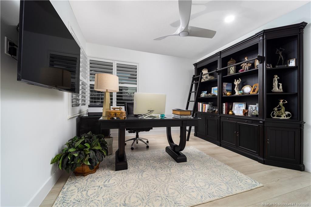 1257 Southeast Brewster Place Stuart, FL 34997 - Photo 28 of 35 a room with furniture and a flat screen tv