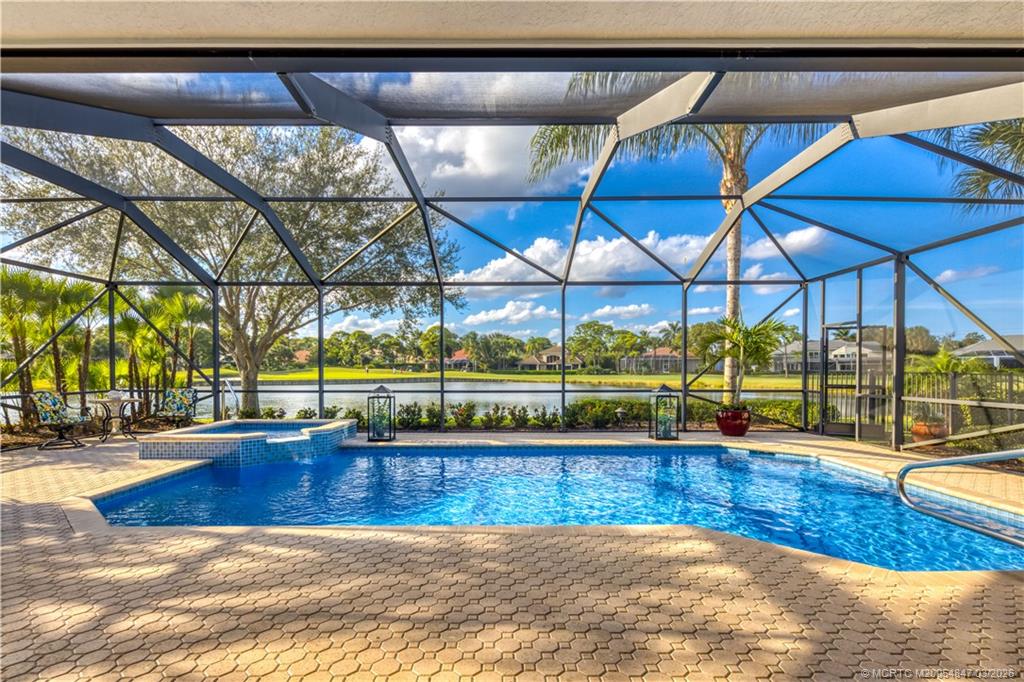 1257 Southeast Brewster Place Stuart, FL 34997 - Photo 32 of 35 a view of a swimming pool with a patio