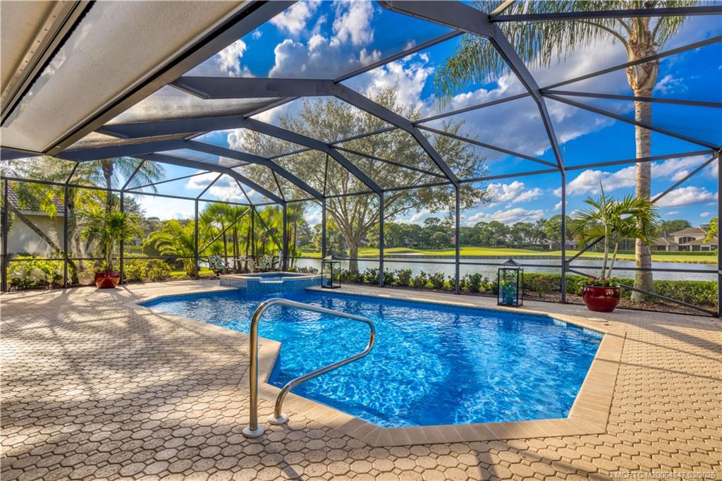 1257 Southeast Brewster Place Stuart, FL 34997 - Photo 33 of 35 a view of a swimming pool with a patio