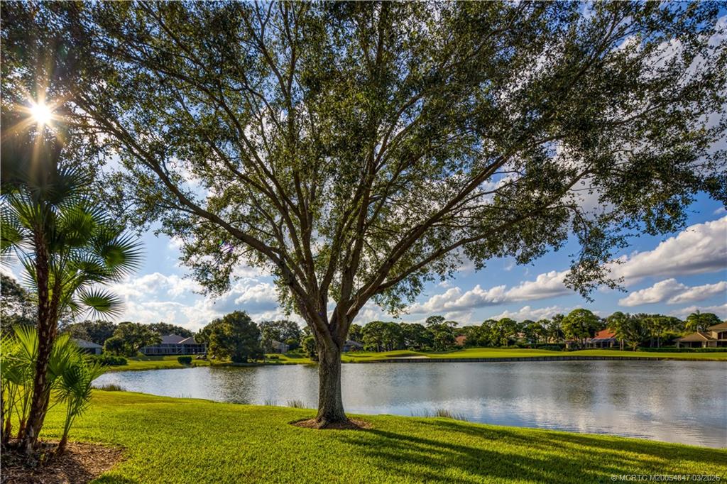 1257 Southeast Brewster Place Stuart, FL 34997 - Photo 35 of 35 a view of a lake with houses in the back