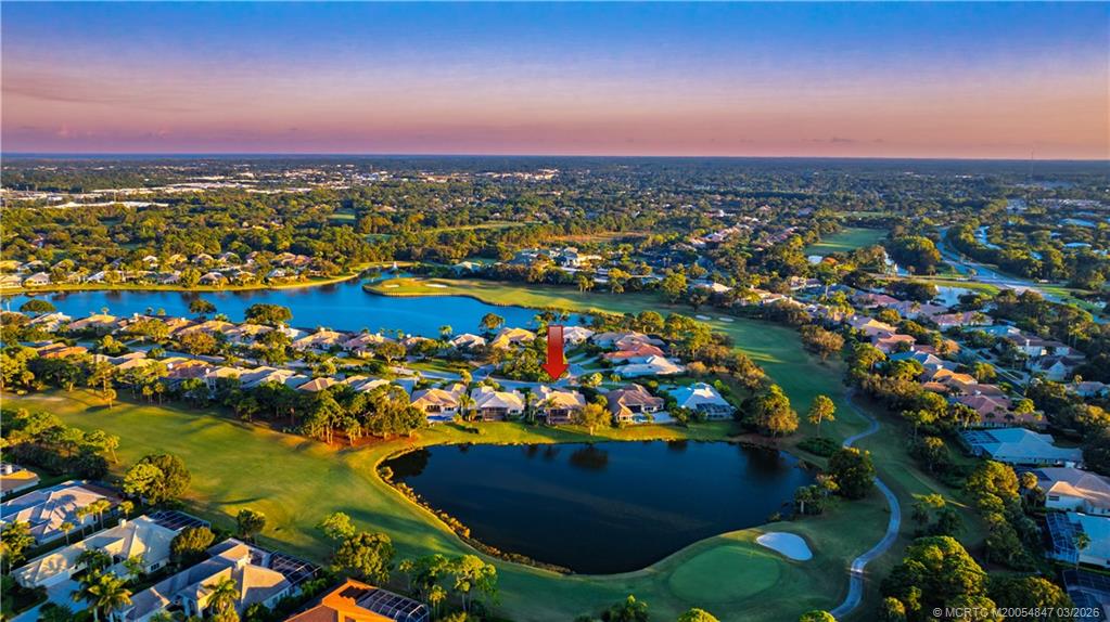1257 Southeast Brewster Place Stuart, FL 34997 - Photo 4 of 35 an aerial view of residential houses with outdoor space