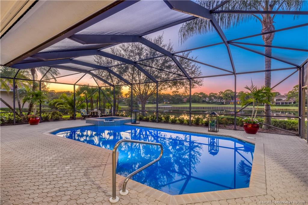 1257 Southeast Brewster Place Stuart, FL 34997 - Photo 7 of 35 a view of a swimming pool with a patio