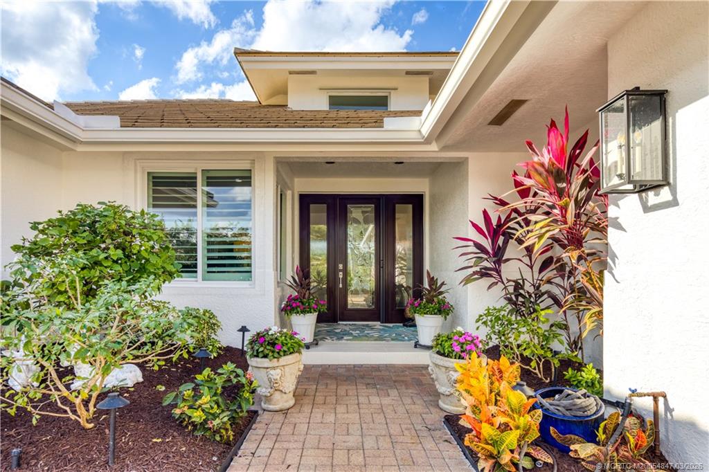 1257 Southeast Brewster Place Stuart, FL 34997 - Photo 8 of 35 a front view of a house