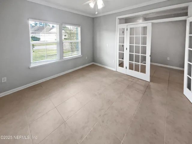 a bathroom with a double vanity sink toilet and shower