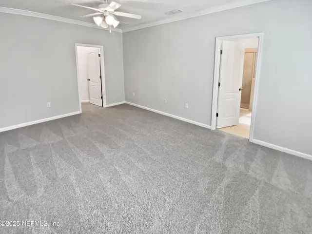 a spacious bathroom with a double vanity sink a mirror and a bathtub
