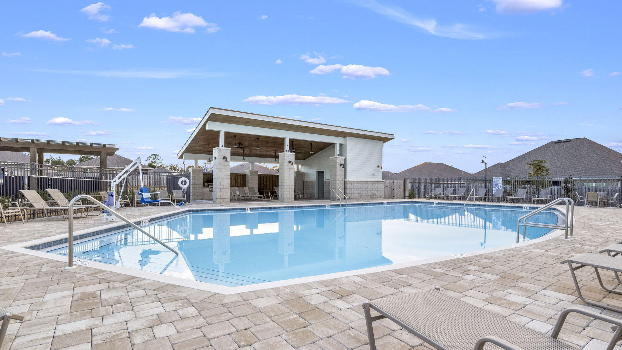 4678 Marine Loop Crestview, FL 32539 - Photo 11 of 16 a view of a swimming pool with a lounge chair