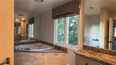 a kitchen with a sink and a large window