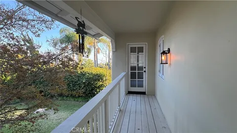 a view of balcony and yard