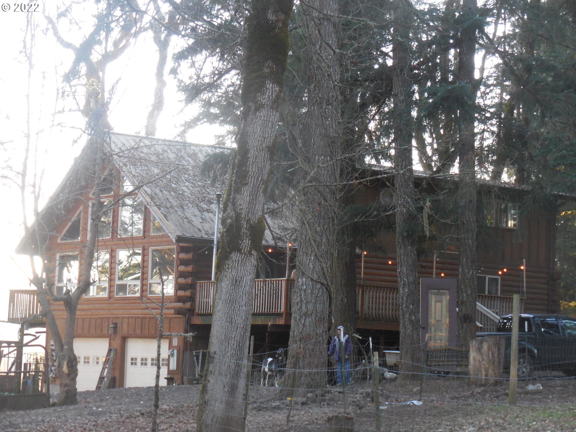 18480 Falls City Road Dallas, OR 97338 - Photo 1 of 32 a view of a building with a tree