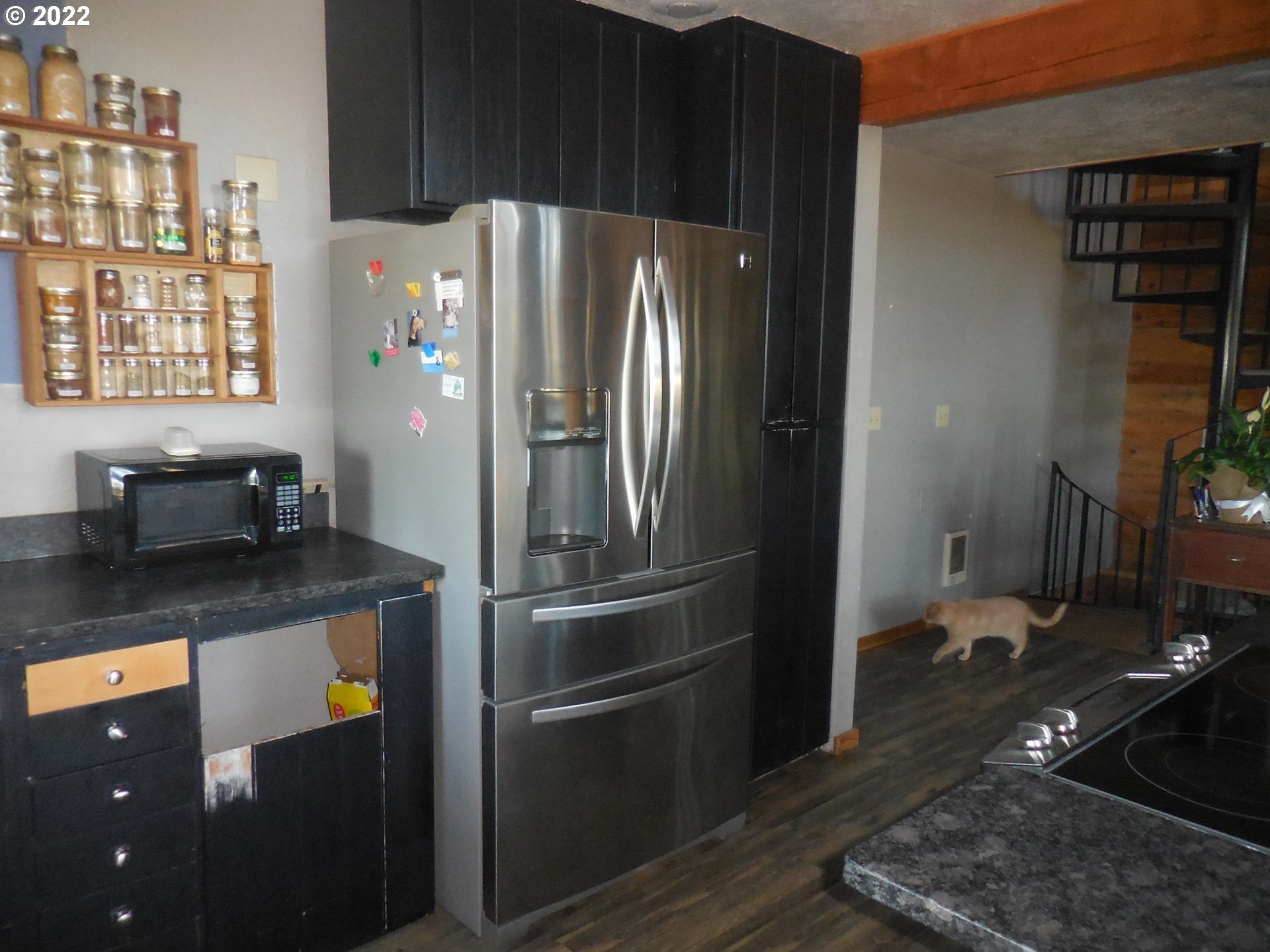 18480 Falls City Road Dallas, OR 97338 - Photo 13 of 32 a kitchen with stainless steel appliances granite countertop a refrigerator and a stove