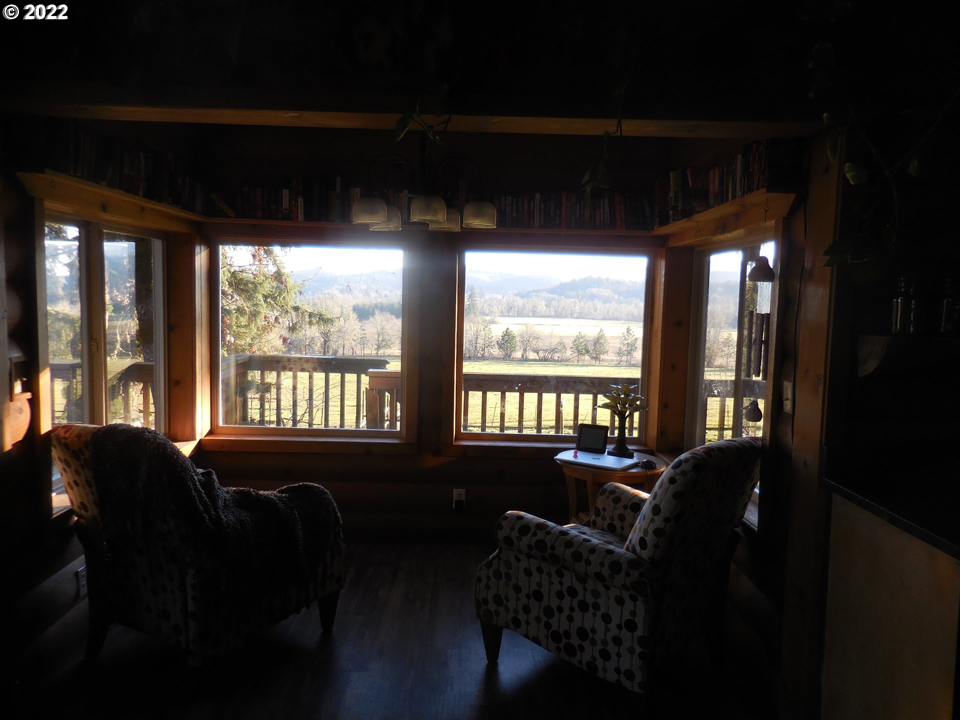 18480 Falls City Road Dallas, OR 97338 - Photo 17 of 32 a living room with furniture and a floor to ceiling window