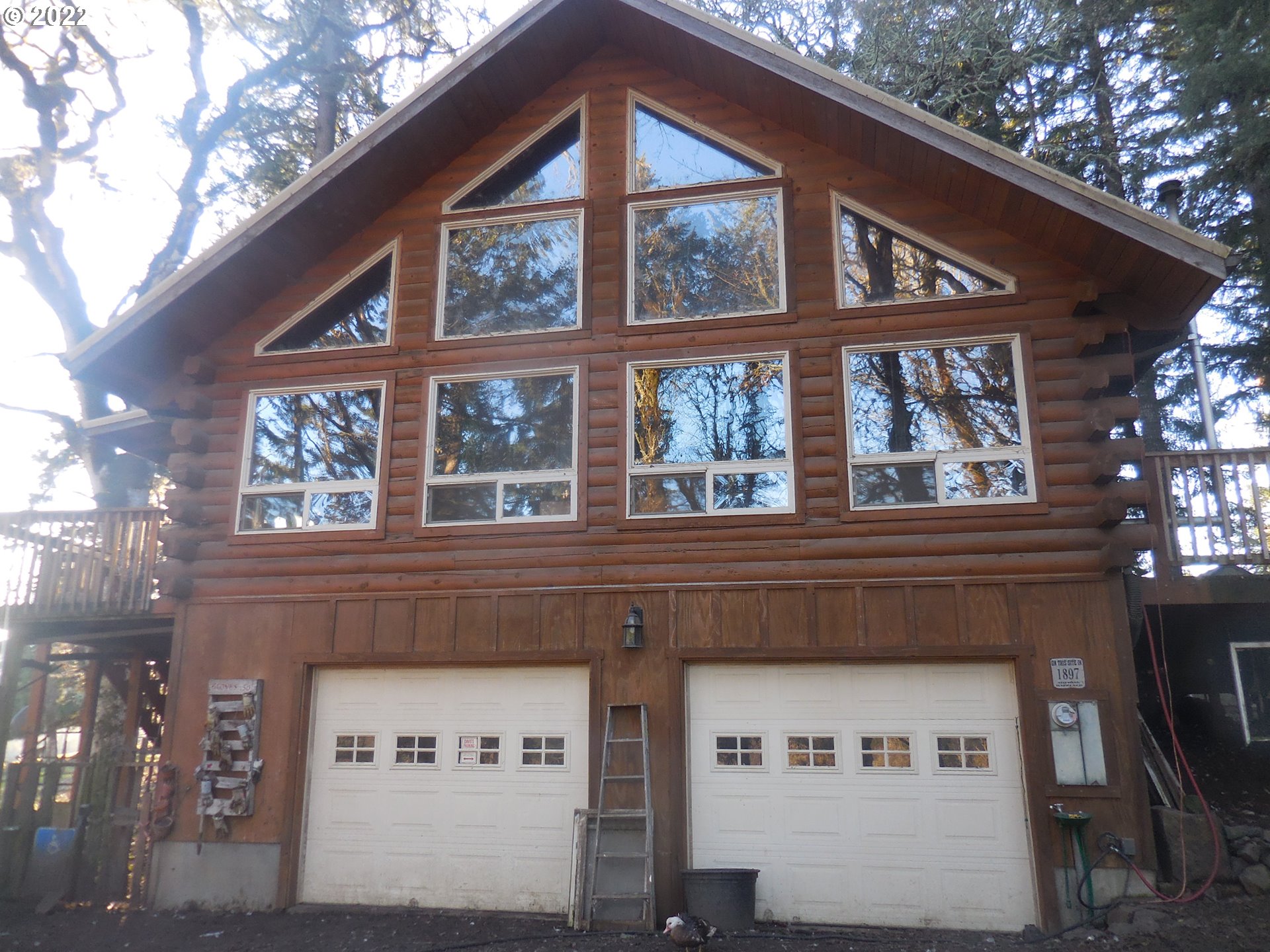 18480 Falls City Road Dallas, OR 97338 - Photo 2 of 32 a view of a building with a tree