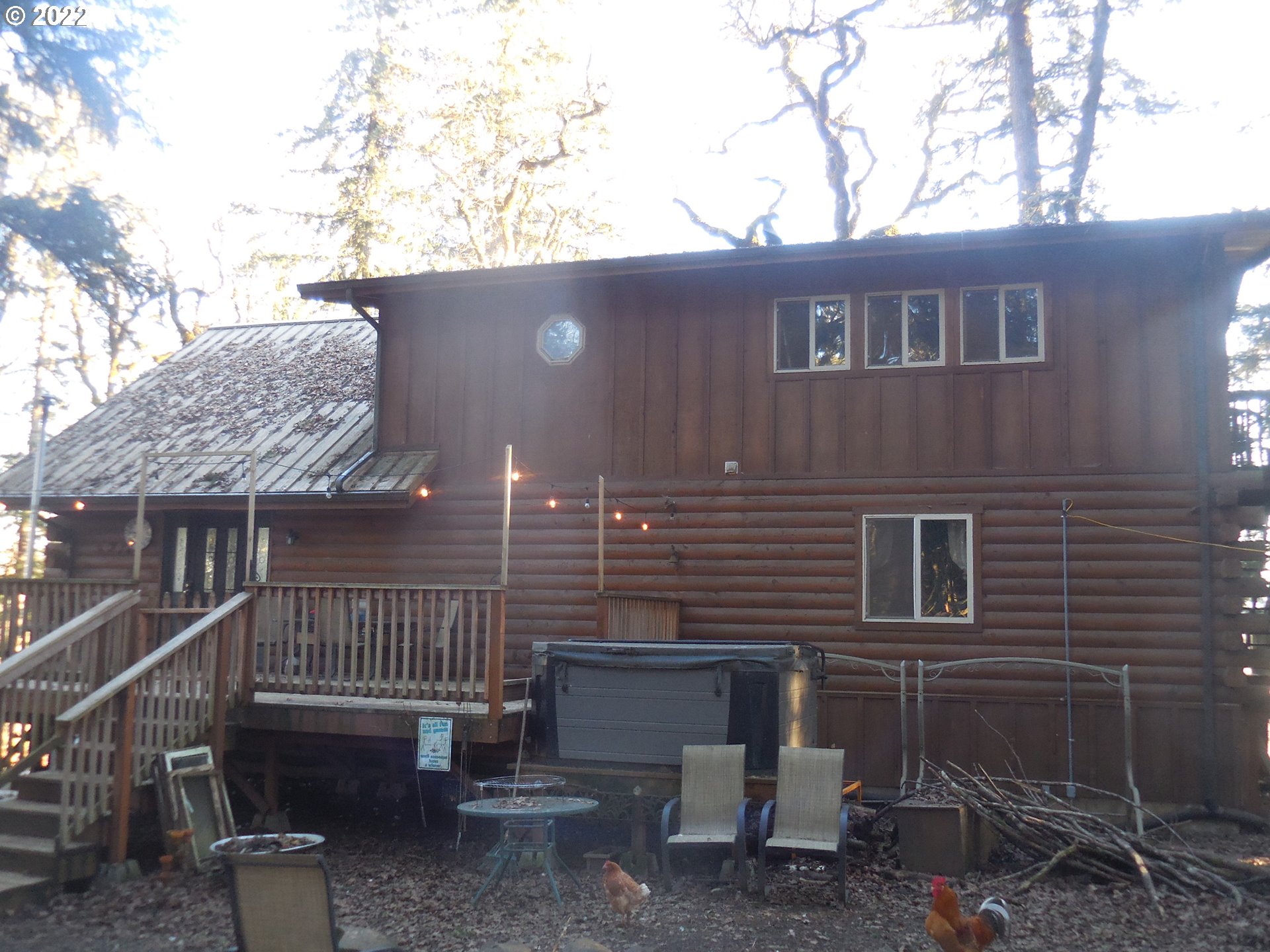 18480 Falls City Road Dallas, OR 97338 - Photo 3 of 32 a view of a house with a yard and deck