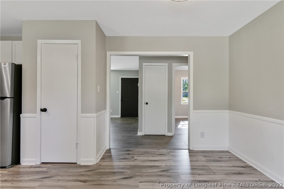 711 Bronco Road Fayetteville, NC 28303 - Photo 14 of 42 an empty room with wooden floor and closet